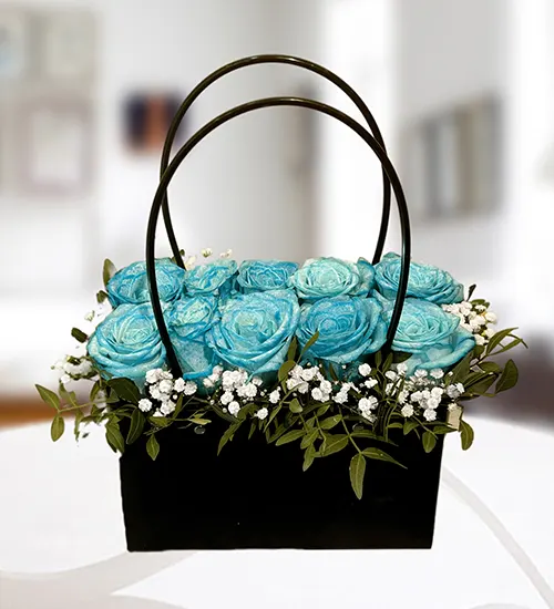 Blue roses in black bag